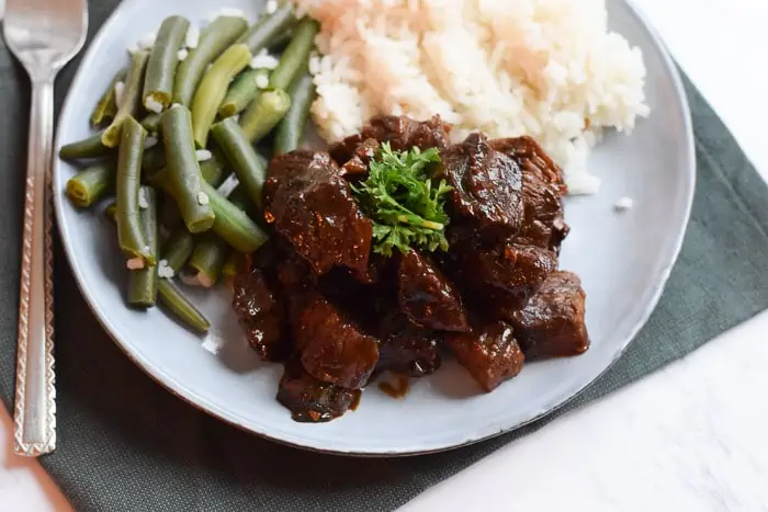 a bowl of Low FODMAP dutch beef stew with green beans and rice