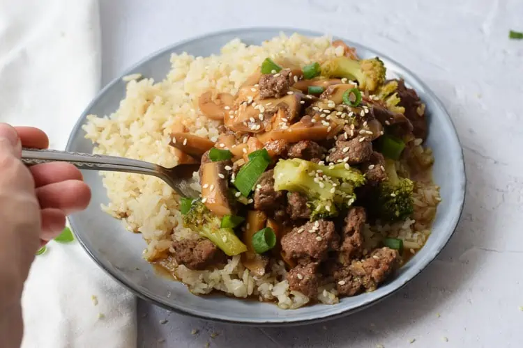 a bowl of Low FODMAP beef and broccoli stir fry with rice